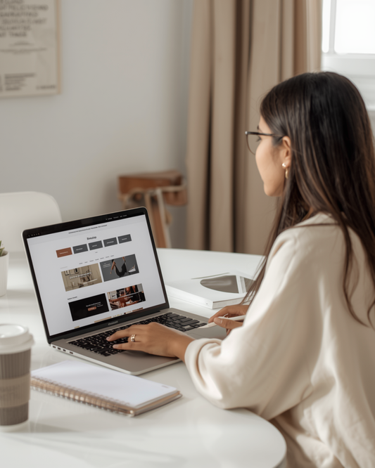 Woman building a professional blog from home office with laptop and organized workspace.